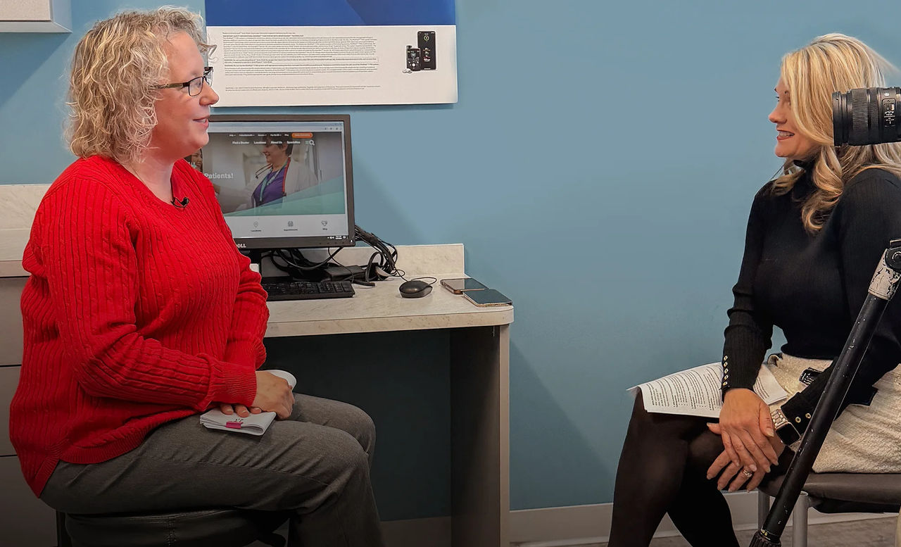 Leslie Debusk during a tv interview discussing heart health