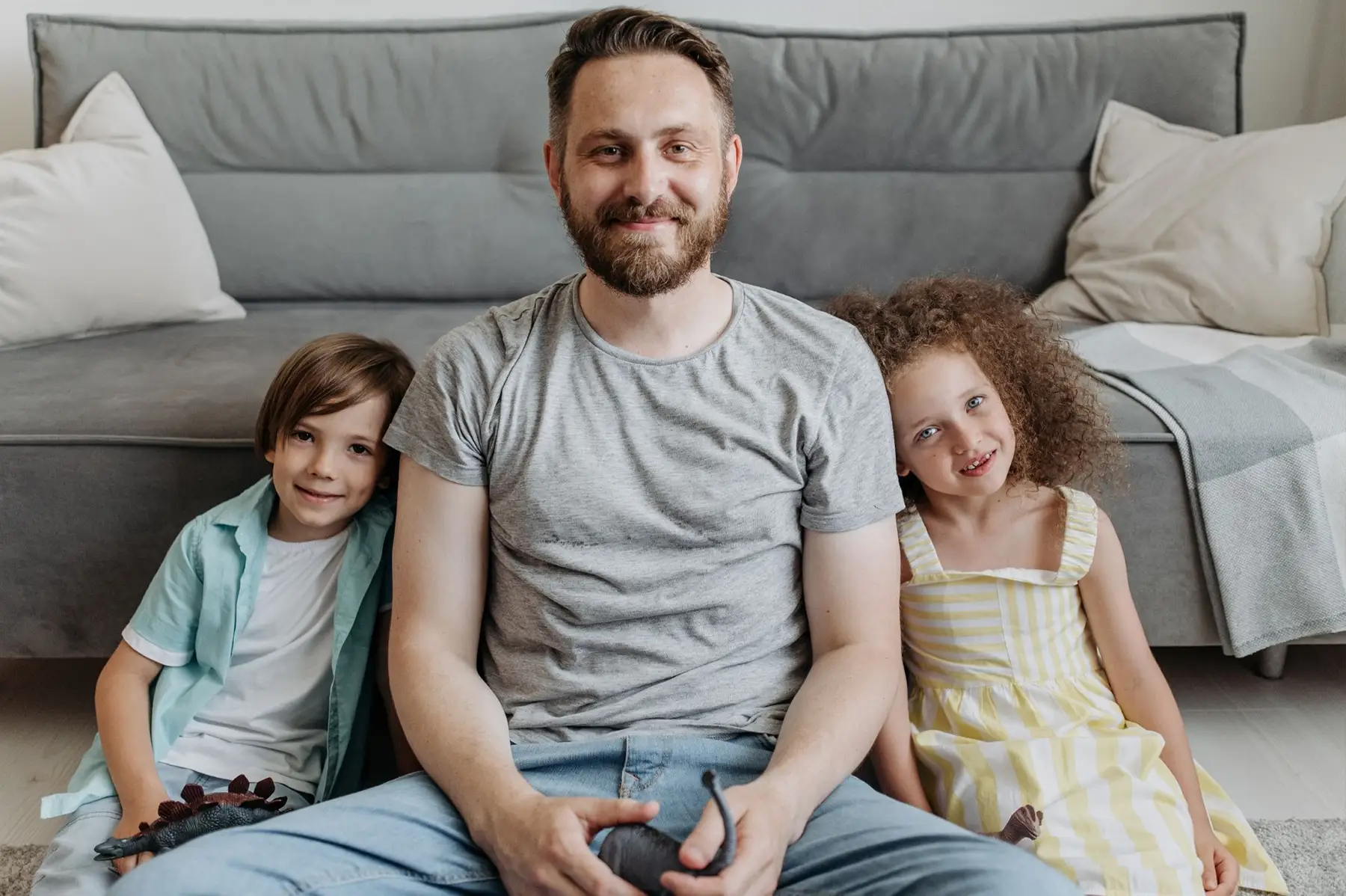 father playing video games with his two children