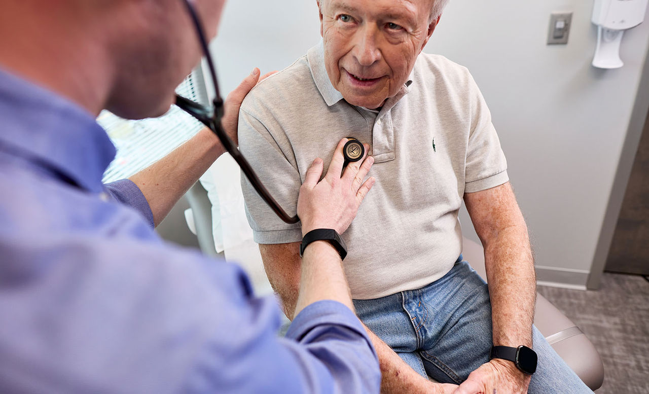 Doctor talking to a senior patient during an exam
