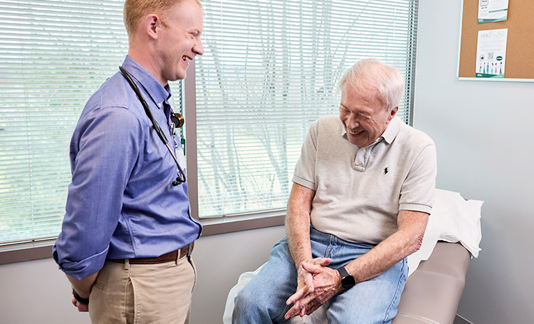 Doctor with a senior patient talking during an exam