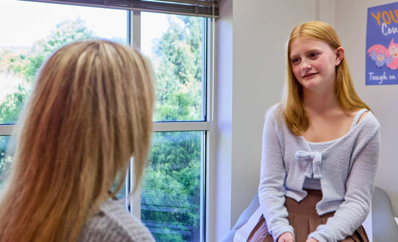 Dr. Lancaster with teen patient