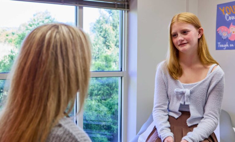 Teen girl talking to a pediatrician