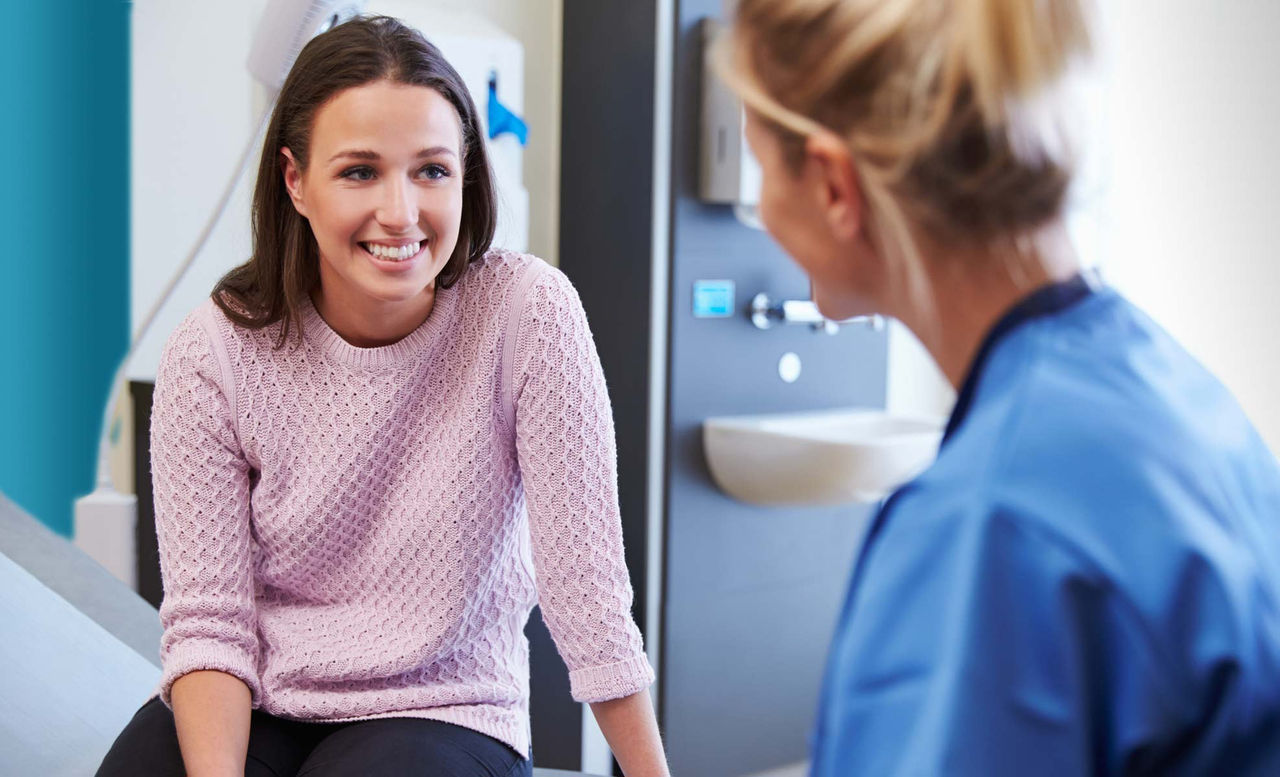nurse and patient during an exam