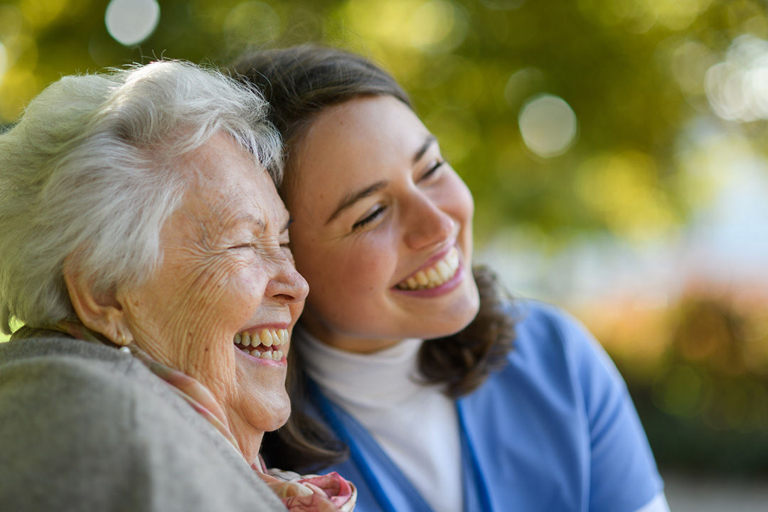 Senior woman visiting with caregiver