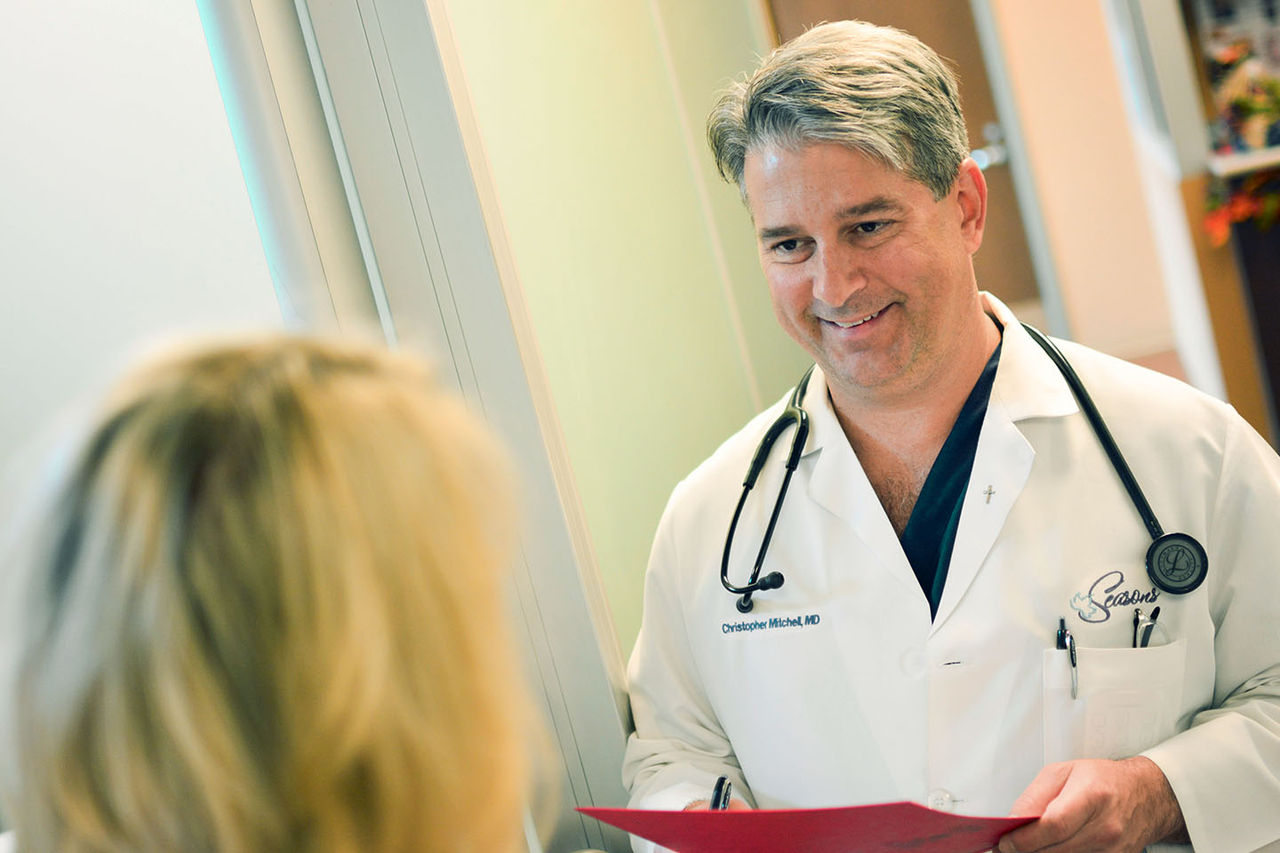 Doctor talking with patient
