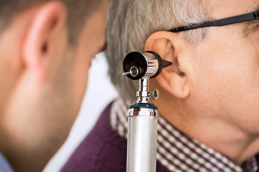 ENT doctor examining a patient