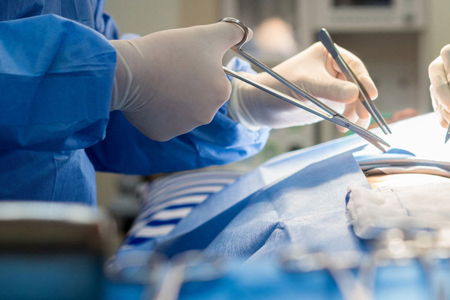 Surgeon performing a surgical procedure in an operating room