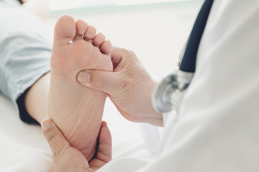 Podiatrist performing a foot exam