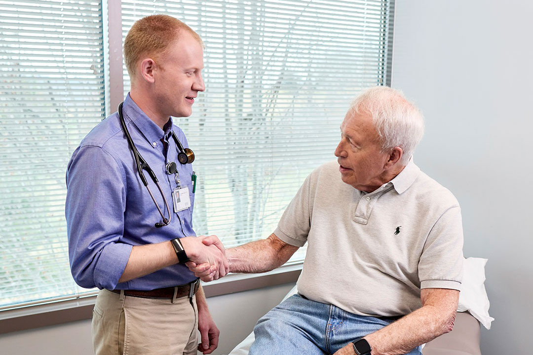 Doctor talking with senior patient